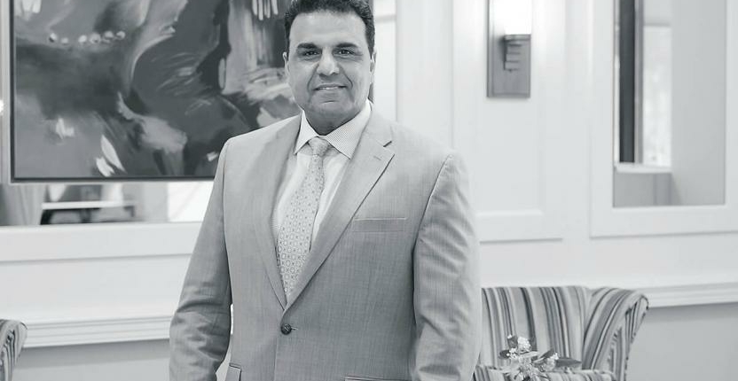 black and white photo of Sam Guedouar, President of Roland Park Place senior living community in Baltimore