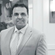 black and white photo of Sam Guedouar, President of Roland Park Place senior living community in Baltimore