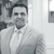 black and white photo of Sam Guedouar, President of Roland Park Place senior living community in Baltimore