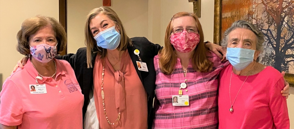 happy staff members of Roland Park Place wearing masks