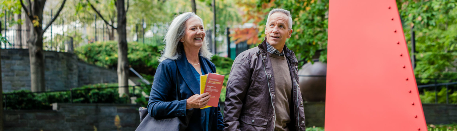 young senior couple walking through Baltimore together