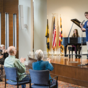 photo of a group of seniors enjoying a presentation at Roland Park Place in Baltimore