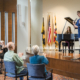 photo of a group of seniors enjoying a presentation at Roland Park Place in Baltimore