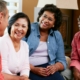 A group of 4 senior friends who are talking and socializing.