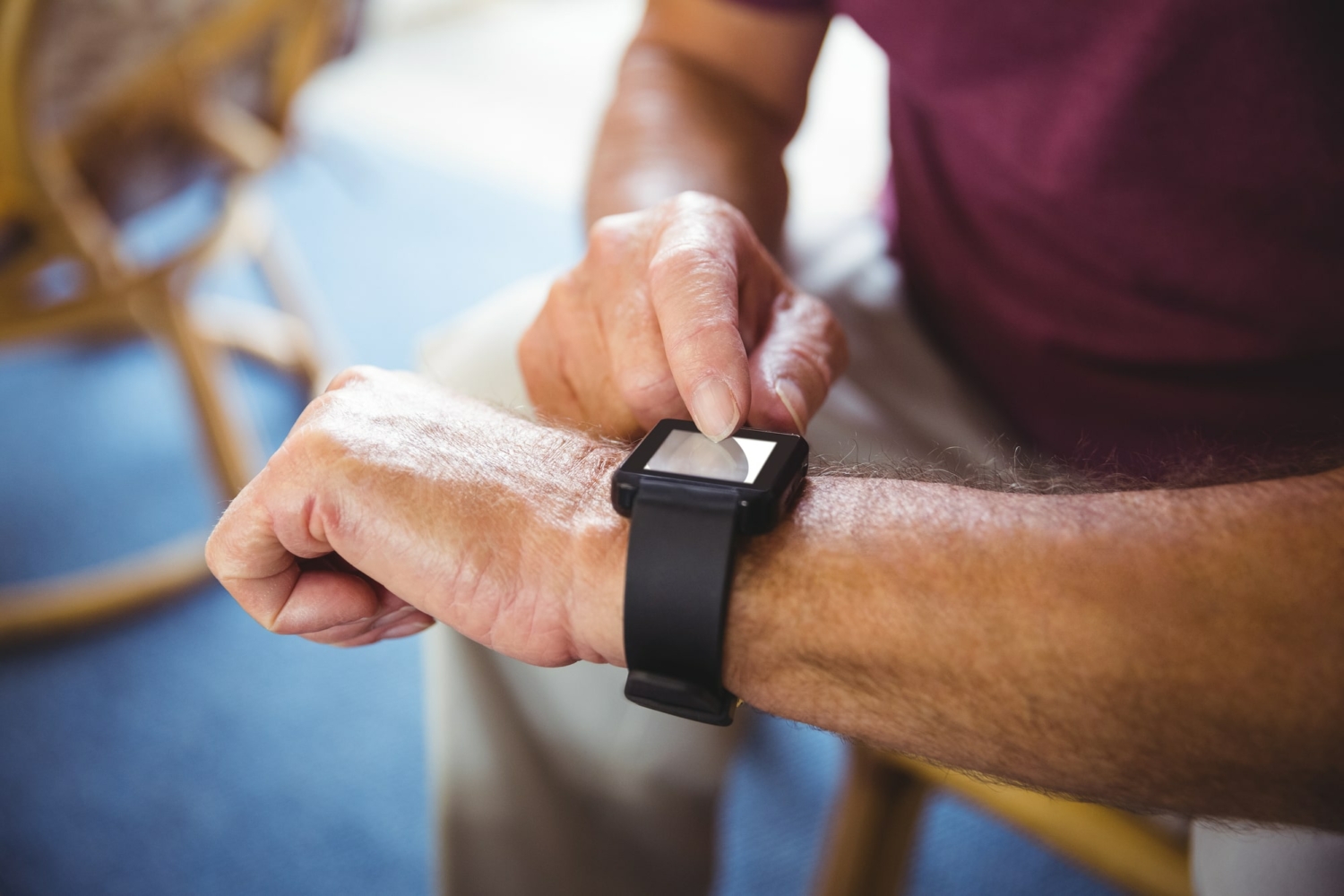 Senior man wearing a smart watch.