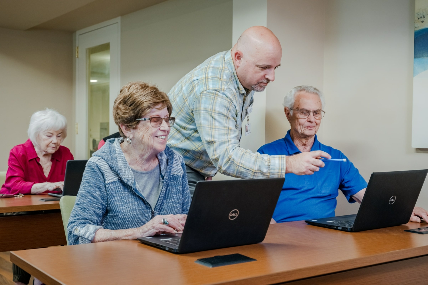 a group of seniors in a tech class at Roland Park Place in Baltimore, MD.