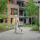 senior resident walking her dog at Roland Park Place, a senior living in Baltimore